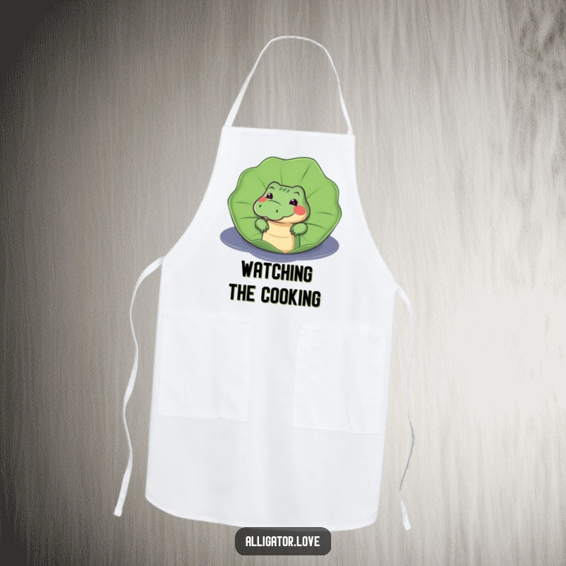 Funny apron featuring a curious alligator peeking from behind a lily pad, designed to add humor to kitchen activities.