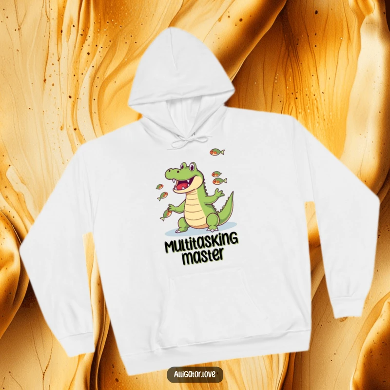 Funny alligator juggling fish, showcasing its snout skills, a comfortable and humorous hoodie.