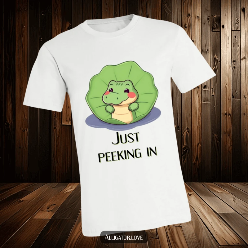 Funny t-shirt showcasing a curious alligator peeking from behind a large lily pad, with eyes full of mischievous wonder.