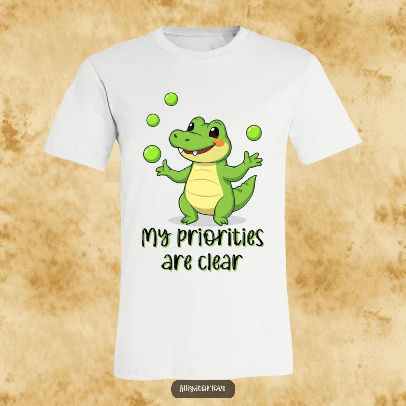 Funny alligator t-shirt showing a smiling alligator expertly juggling small green balls, radiating pure joy and amusement.